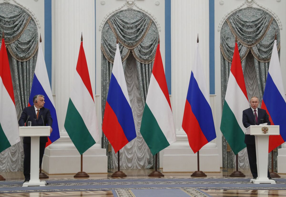 FILE - Hungary's Prime Minister Viktor Orban, left, and Russian President Vladimir Putin attend a joint news conference following their talks in the Kremlin in Moscow, Russia, Feb. 1, 2022. Orban, has nurtured close political and economic ties with Russia for more than a decade. But following Russia's large-scale invasion of Ukraine, Hungary's neighbor, Orban is facing growing pressure to change course. (Yuri Kochetkov/Pool Photo via AP)