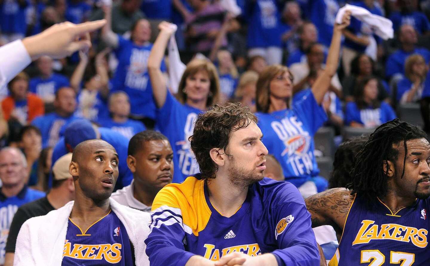 Kobe Bryant, Pau Gasol and Jordan Hill can only watch in the final minutes as the Thunder finish off a 119-90 rout in Game 1 of their playoff series on Monday night in Oklahoma City.