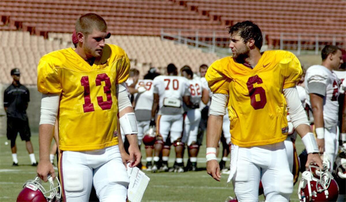 USC quarterbacks Max Wittek, left, and Cody Kessler walk off the field after a scrimmage at the Coliseum.