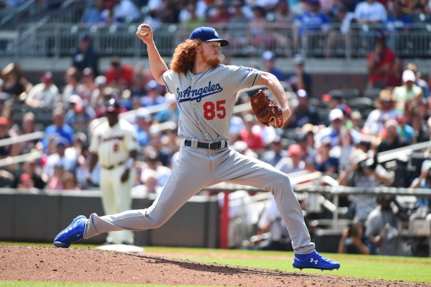 ATLANTA, GEORGIA - AUGUST 18: Dustin May #85 of the Los Angeles Dodgers pitches in the 6th inning against the Atlanta Braves at SunTrust Park on August 18, 2019 in Atlanta, Georgia. (Photo by Logan Riely/Getty Images)