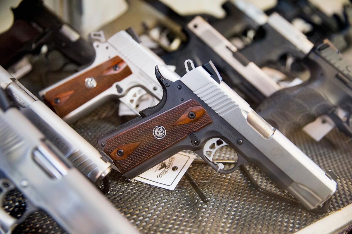 Handguns are offered for sale at store in Illinois on March 11. According to a survey conducted by the University of Chicago, 32% of Americans own guns, down from a high of 50% in the 1970s and early 1980s.