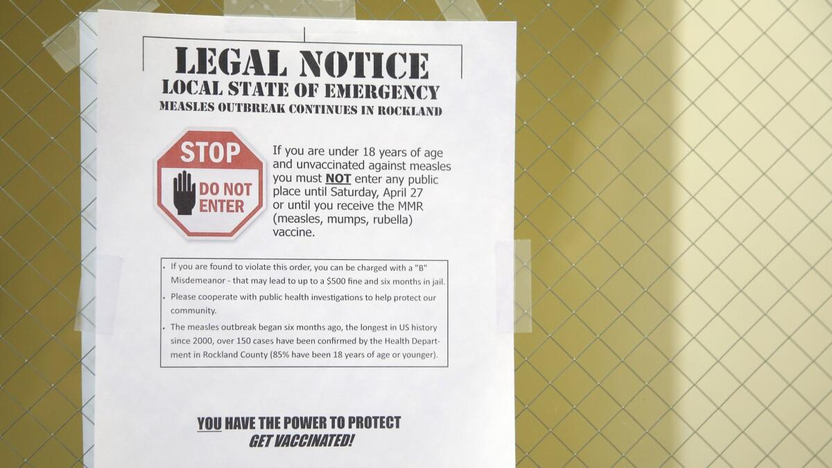 A sign explains the local state of emergency at the Rockland County Health Department in Pomona, N.Y., after a measles outbreak.