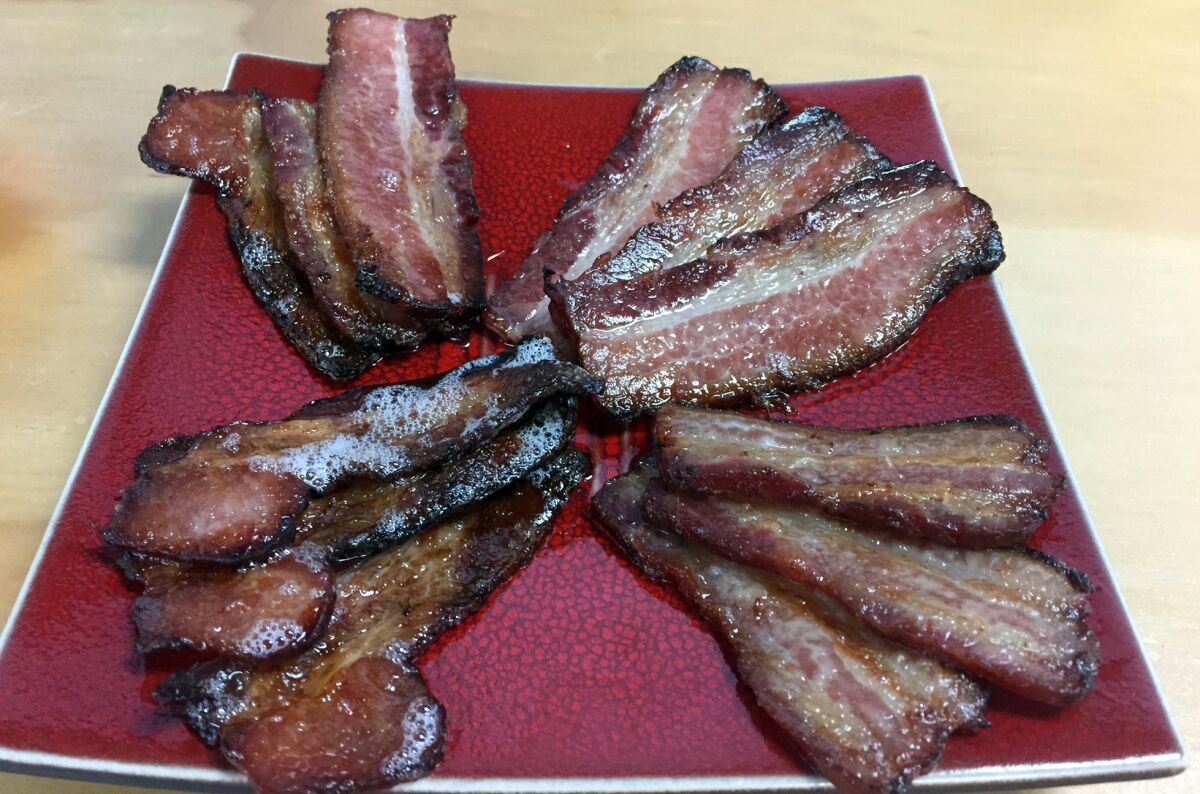 A selection of fresh-cooked artisan flavored bacons from Bacon Swinery.