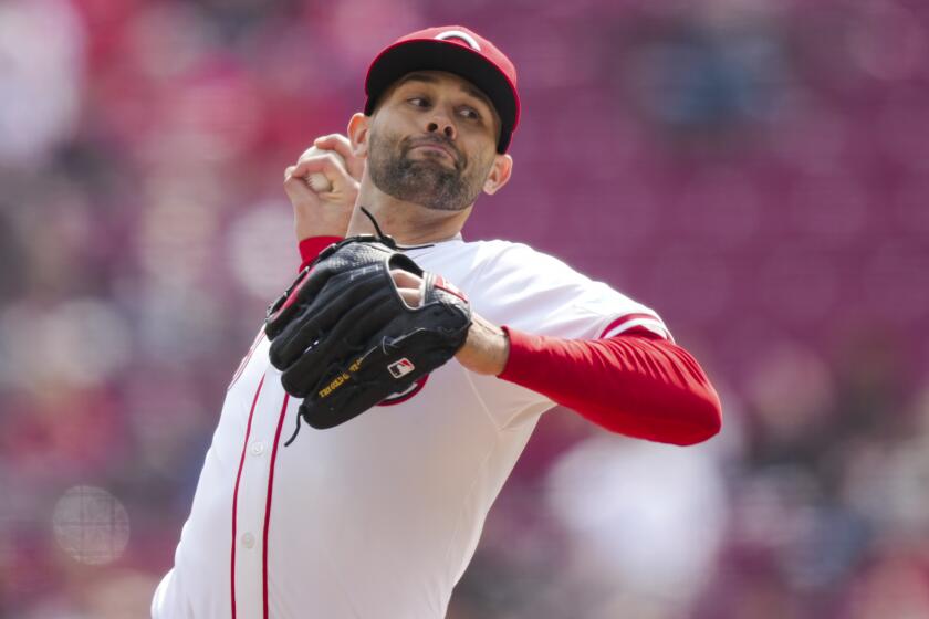 Cincinnati Reds' Nick Martinez throws during a baseball game against the Washington Nationals in Cincinnati, Sunday, March 31, 2024. (AP Photo/Aaron Doster)