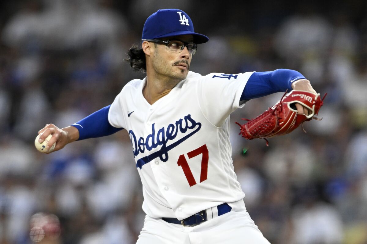 Newly acquired Dodgers relief pitcher Joe Kelly delivers against the Reds in the sixth inning Saturday.