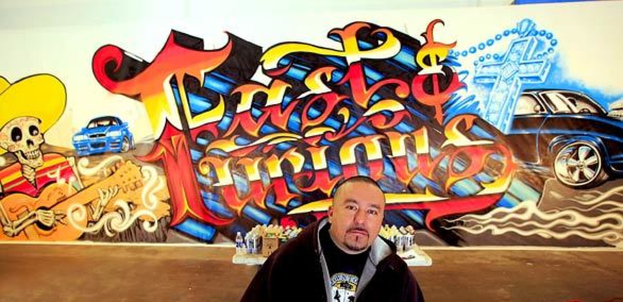 Mister Cartoon, seen here in his L.A. warehouse studio in 2009 working on a billboard commissioned by Universal Studios for "Fast & Furious."