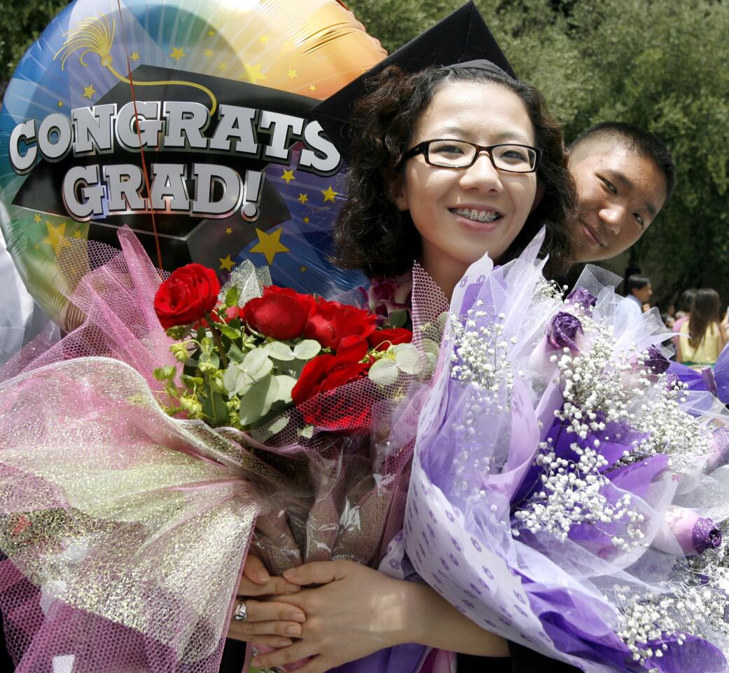 Doris Xin, with flowers asnd balloon from her family, received her BS in Computer Science at the California Institute of Technology's 118th Annual Commencement at the Pasadena campus on Friday, June 15, 2012.