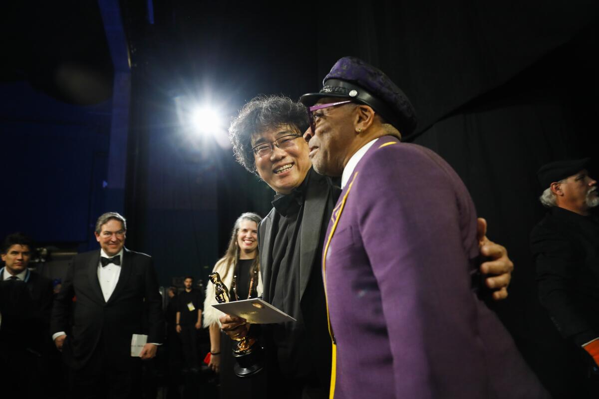 Bong Joon Ho after being named winner of the directing Oscar for “Parasite” with Spike Lee, who presented the award