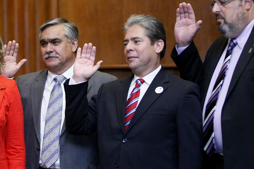 From left, Burbank City Council members Jess Talamantes, Bob Frutos and David Gordon are sworn into office, in this file photo taken on Wednesday, May 1, 2013. The trio are running for reelection and are facing five challengers.