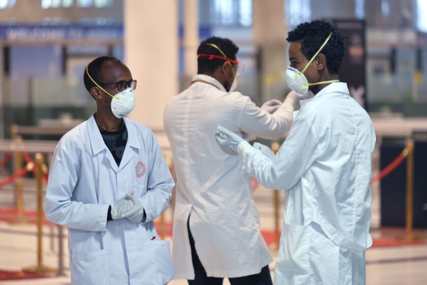 Medical staff of the Ethiopian Ministry of Health prepare to screen passengers at Bole International Airport in Addis Ababa, on January 30, 2020, following an outbreak of coronavirus in China. - As of January 30, some 7,700 cases have been confirmed in China, its country of origin, with at least 170 fatalities. The virus has spread from the city of Wuhan across China to more than 15 countries, with about 60 cases in Asia, Europe, North America and, most recently, the Middle East. (Photo by Michael Tewelde / AFP) (Photo by MICHAEL TEWELDE/AFP via Getty Images)