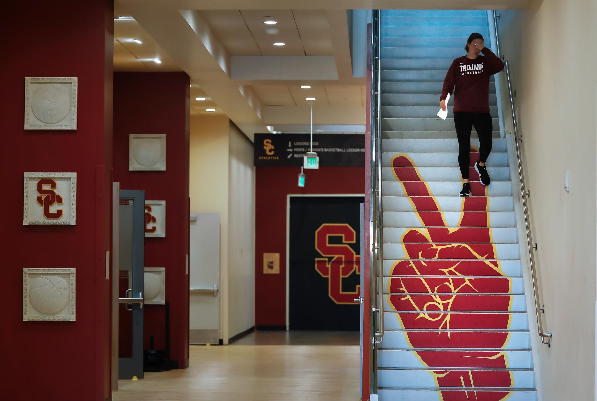 Lindsay Gottlieb heads downstairs during team practice to pump breastmilk in her office.