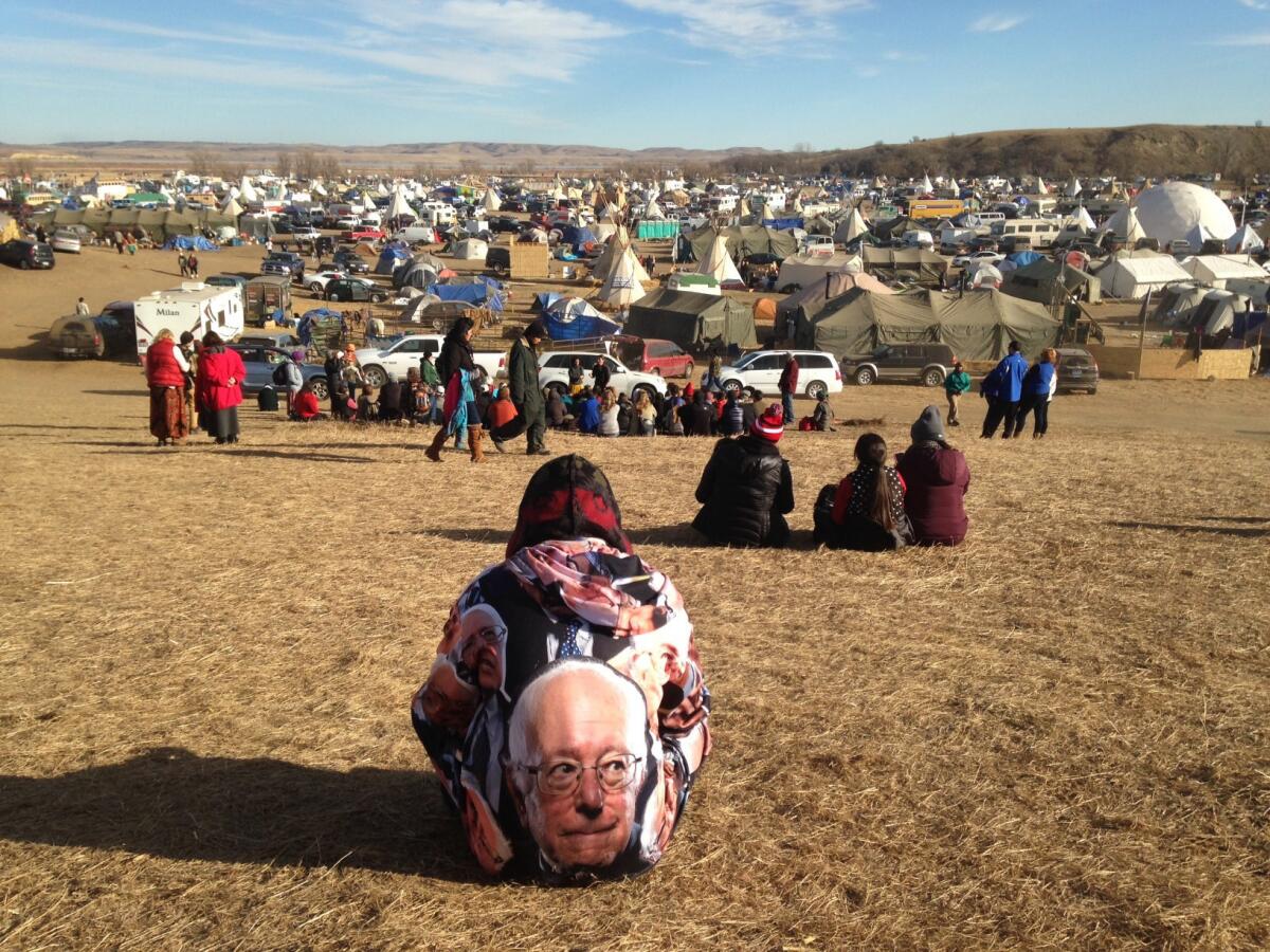 Protesters gather at an encampment near Cannon Ball, N.D., on Saturday, a day after tribal leaders received a letter from the U.S. Army Corps of Engineers saying the federal land would be closed to the public Dec. 5.