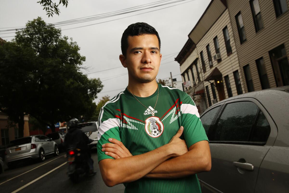 Ricardo Aca works as a busboy at a restaurant in Trump SoHo condo tower. He became a YouTube hit with his video speaking out against Trump's immigration comments.