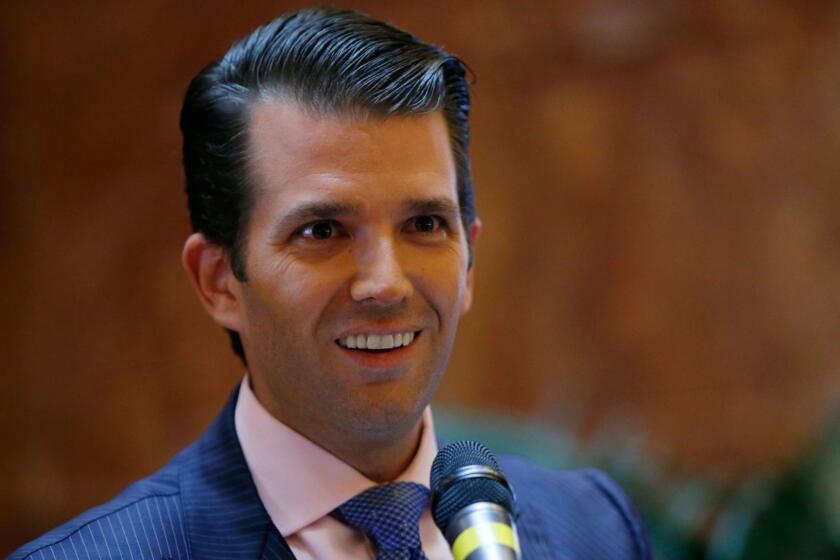 FILE - In this June 5, 2017, file photo, Donald Trump Jr., executive vice president of The Trump Organization, announces that the family's company is launching a new hotel chain inspired by his and brother Eric's Trump's travels with their father's campaign at Trump Tower in New York. Trump Jr. shared a video on July 8, 2017, of an edited clip of the 1986 military thriller âTop Gunâ in which President Donald Trumpâs face is superimposed over Tom Cruiseâs character as he shoots down a Russian jet with a CNN logo on it. (AP Photo/Kathy Willens, File)