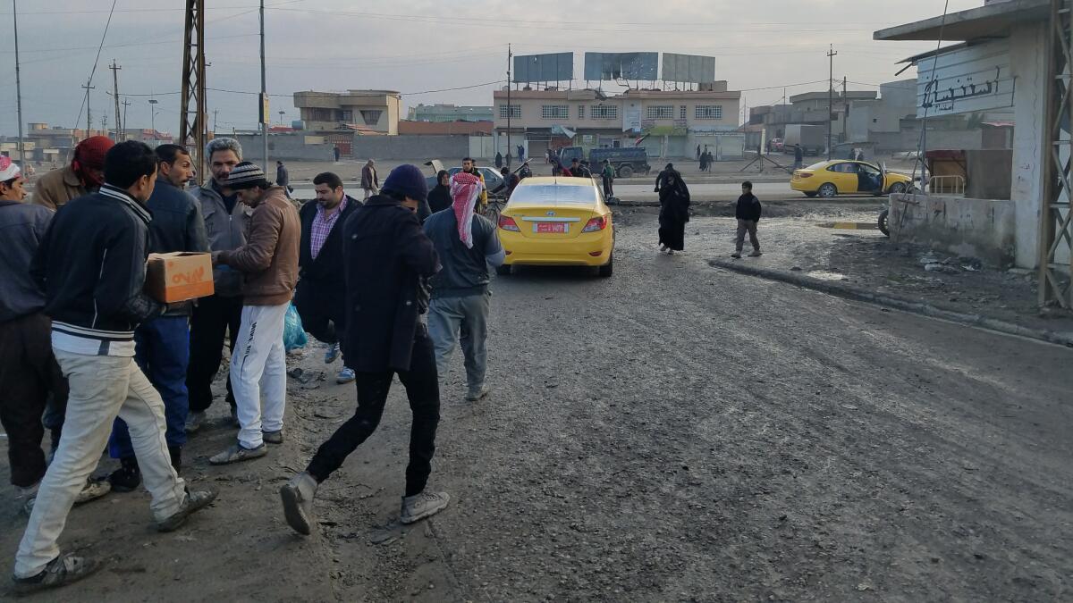 Sadi Mohamed drives his taxi away from a market in the Mosul suburb of Gogjali. Days later, multiple suicide bombers attacked the market, killing 23 people.