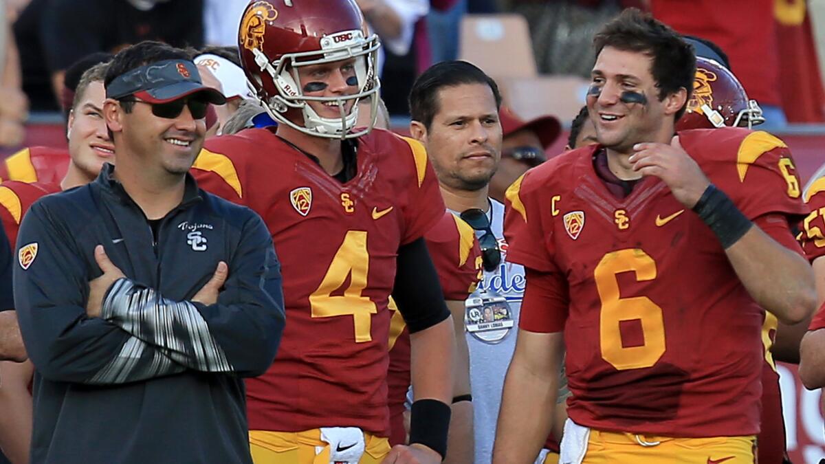 USC Coach Steve Sarkisian rolls into the 2015 season with a proven starting quarterback in Cody Kessler (6) and reliable backup in Max Browne (4).