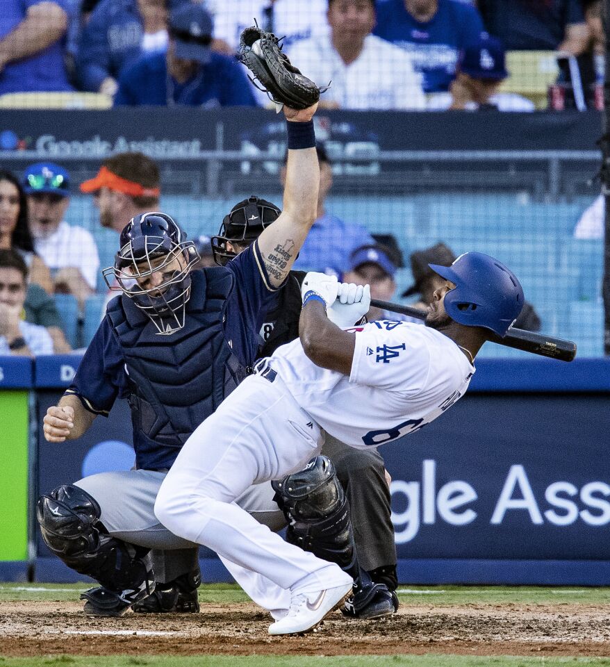 Dodgers right fielder Yasiel Puig is brushed back off the plate with an inside pitch in the eighth inning.