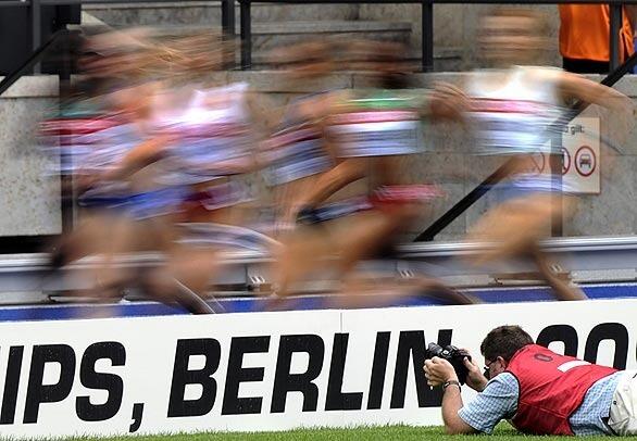 A photographer captures a women's 1,500-meter heat at the 12th IAAF World Championships.