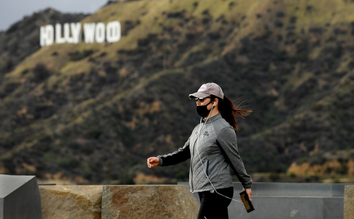 A woman hikes in Griffith Park on Monday