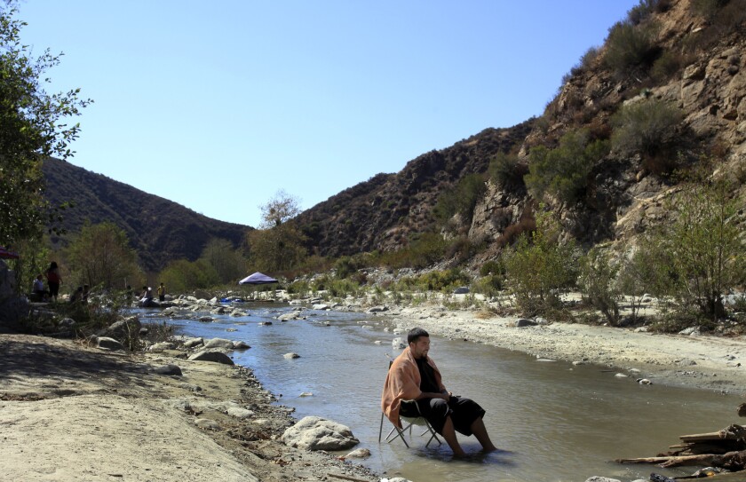 Brian Campos of Anaheim relaxes in the East Fork of the San Gabriel River in the Angeles National Forest in August. The area will be part of the new San Gabriel Mountains National Monument.