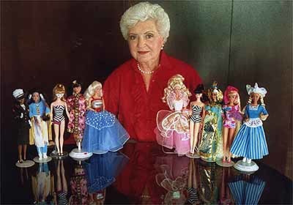 Ruth Handler with Barbies in 1999; she also made prostheses for breast cancer patients.