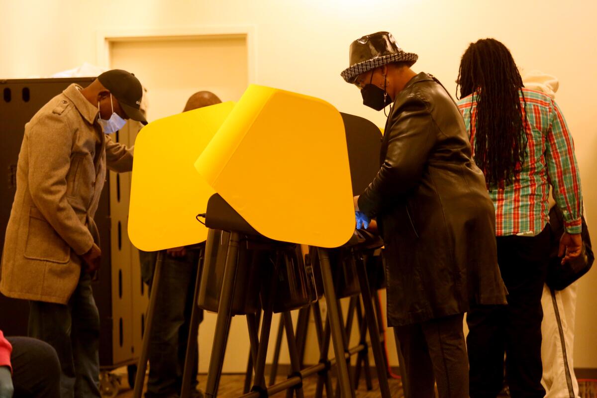 People cast their ballots at a polling station