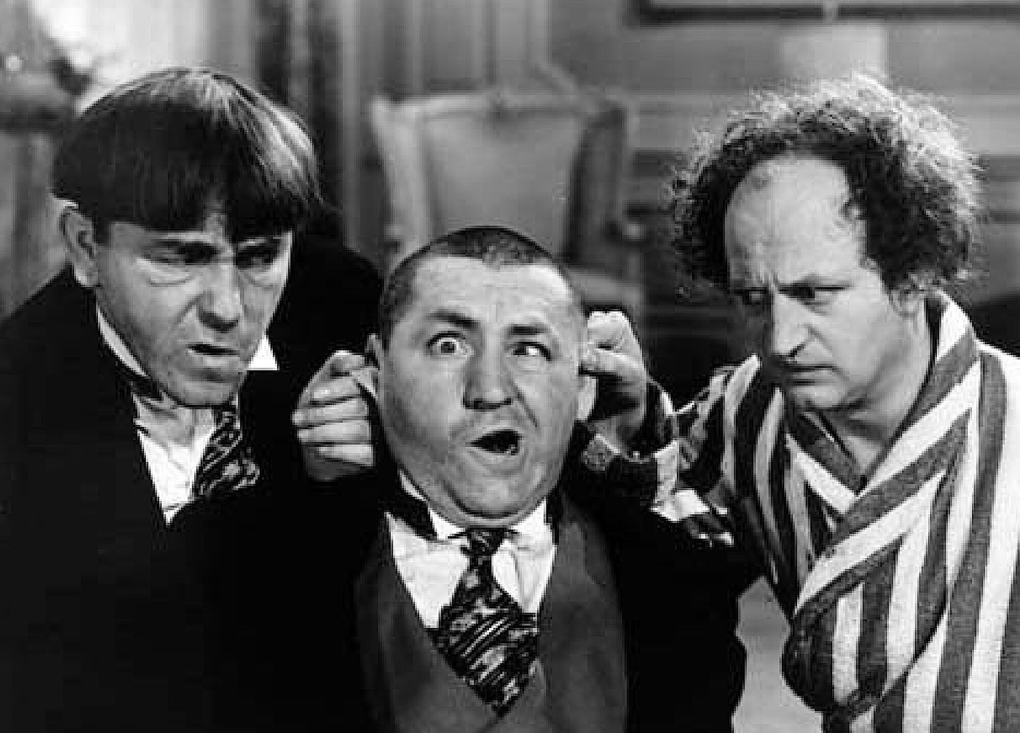 The Three Stooges' Moe Howard, left, Curly Howard and Larry Fine