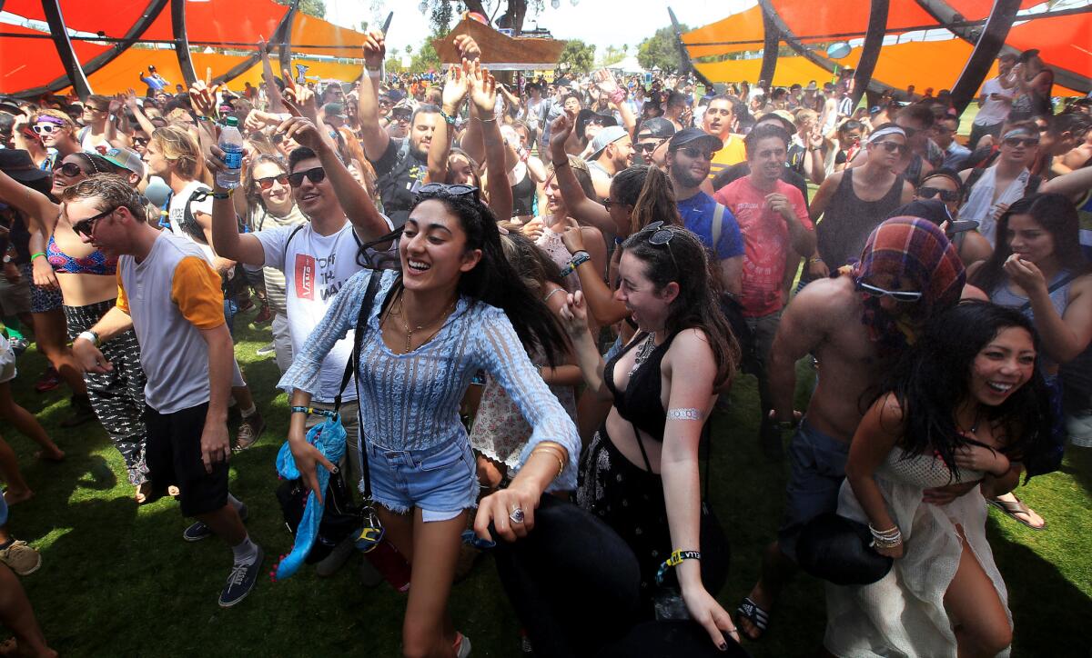 Music fans get into the beats at the Do Lab on Day 1 of the Coachella Valley Music and Arts Festival in Indio, Calif., on Friday.