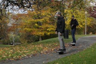 File - Two people ride Onewheels through Wright Park in Tacoma, Wash., on Oct. 26, 2018. All models of Onewheel self-balancing electric skateboards are under recall after at least four deaths and multiple injuries were reported in recent years, federal regulators said last week.(AP Photo/Ted S. Warren, File)