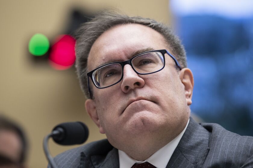 FILE - In this Feb. 27, 2020 file photo, Environmental Protection Agency Administrator Andrew Wheeler pauses as he testifies during a hearing of the House Committee on Energy and Commerce Subcommittee on Environment and Climate Change during a hearing on Capitol Hill in Washington. Six former Environmental Protection Agency chiefs are calling for an agency reset after President Donald Trump’s regulation-chopping, industry-minded first term. The group is presenting a detailed action plan drafted by former EPA staffers for whoever wins the Nov. 3 presidential election. (AP Photo/Alex Brandon)