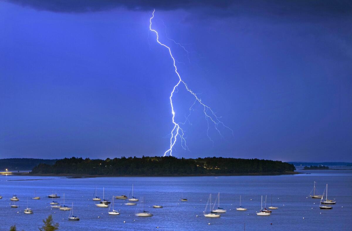 Lightning strikes north of Macworth Island in Portland, Maine, in September. A new study says lightning strikes in the U.S. will likely increase by nearly 50% by the end of the century because of climate change.
