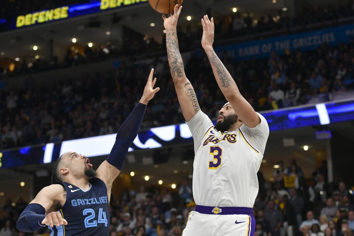 Lakers forward Anthony Davis elevates for a shot over Grizzlies forward Dillon Brooks during Game 1.