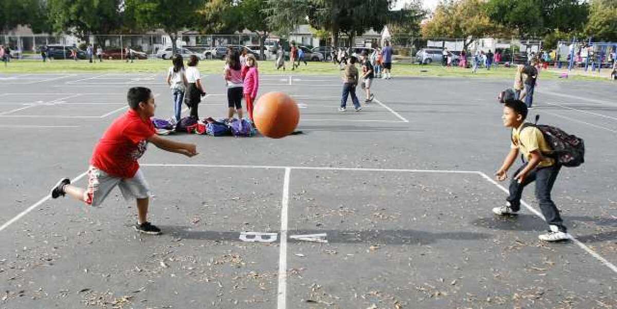 Kids play two square and four square at McKinley Elementary School in Burbank during the After School Daze city run after-school program. The $60,000 program could be cut or restructured next fiscal year.