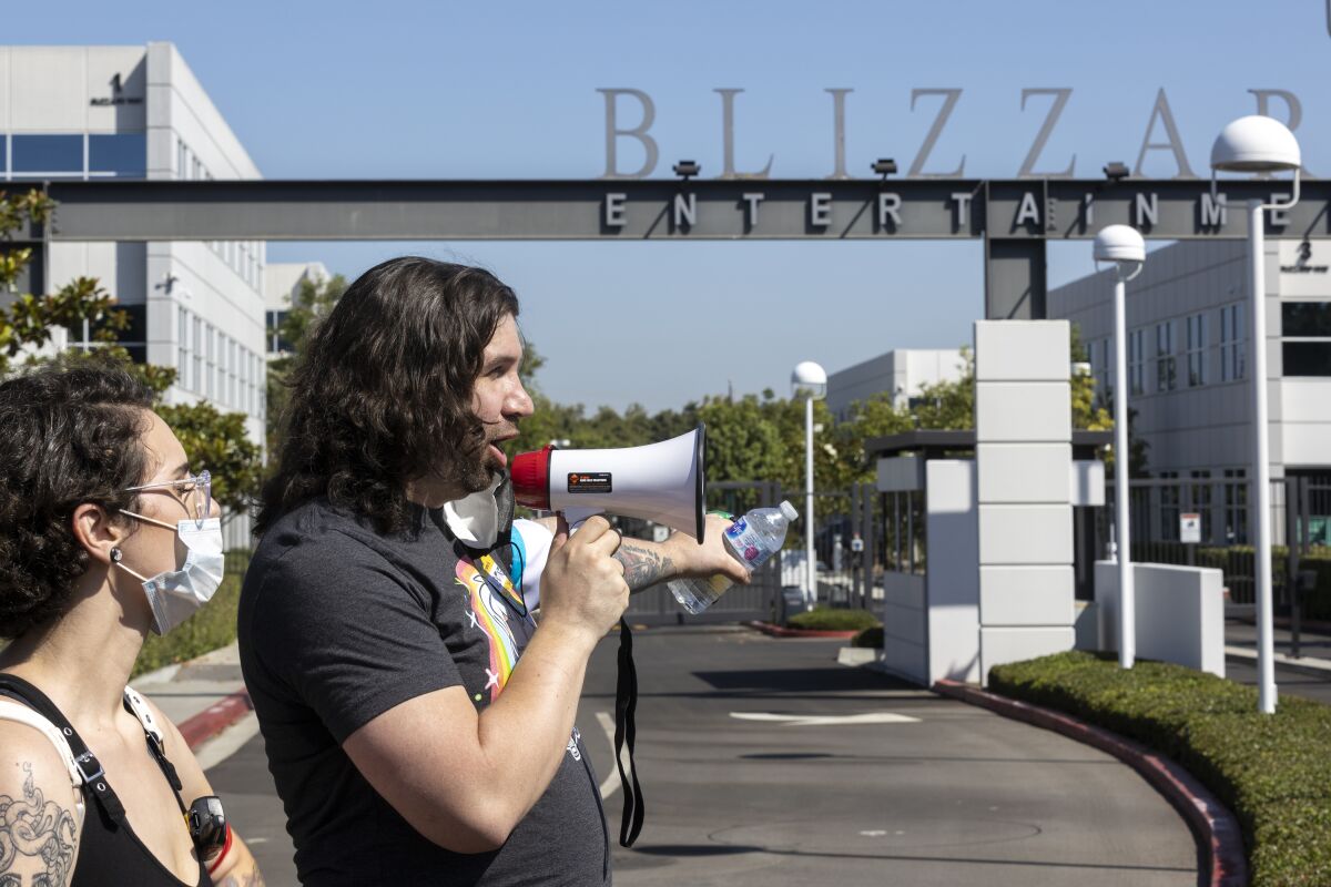 Activision Blizzard employees protest outside the company's Irvine offices in July 2021. 