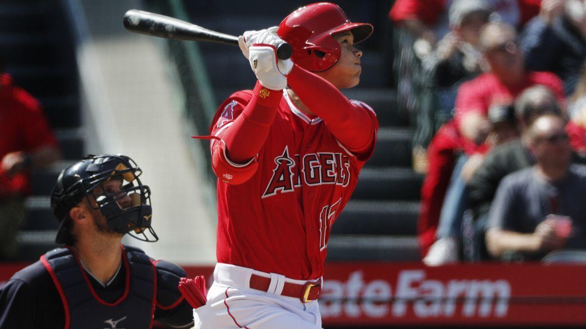 Angels designated hitter Shohei Ohtani hits a fifth-inning, two-run homer to tie the score against the Cleveland Indians on Wednesday at Angel Stadium.
