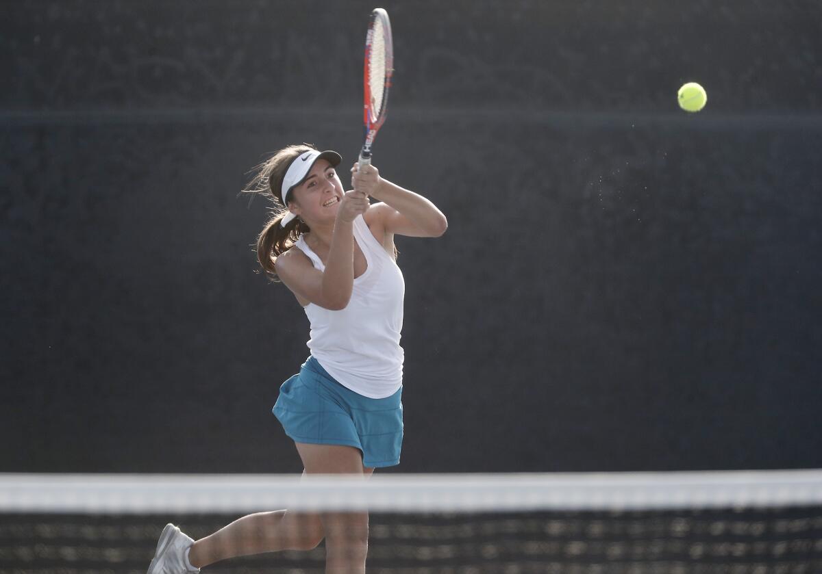 Corona del Mar's Kristina Veskovic returns a volley in a singles set against Huntington Beach's Sahiba Grewal in the semifinals of the CIF Southern Section Division 1 playoffs on Wednesday.