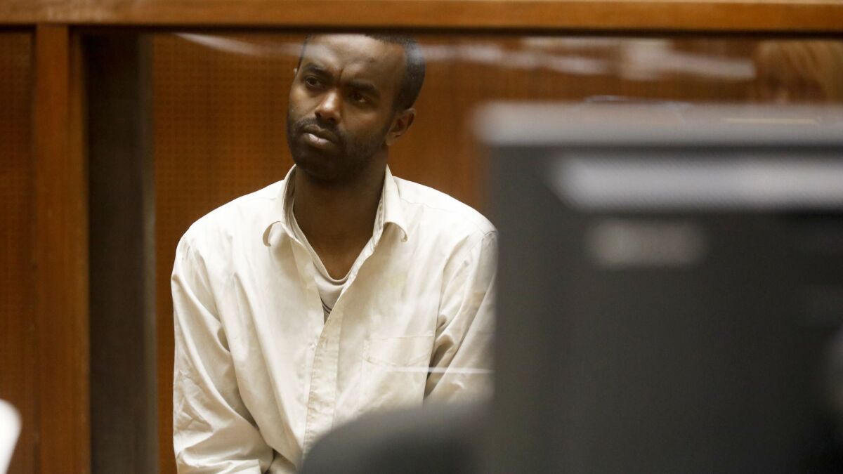 Mohamed Abdi Mohamed, accused of attacking two Jewish men outside a Los Angeles synagogue, listens during a court appearance in Los Angeles after his arrest in late November.