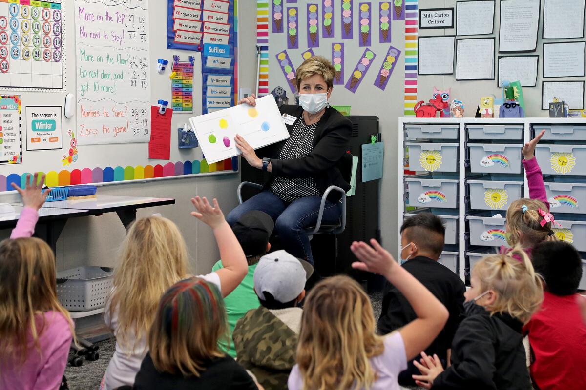 Mayor Barbara Delgleize reads to kids in Joy Forgiarini's classroom during National Read Across America Day on Wednesday.