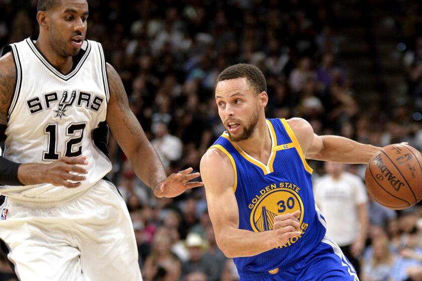 Golden State Warriors guard Stephen Curry (30) drives around San Antonio Spurs forward LaMarcus Aldridge during the first half of an NBA basketball game, Wednesday, March 29, 2017, in San Antonio. (AP Photo/Darren Abate)