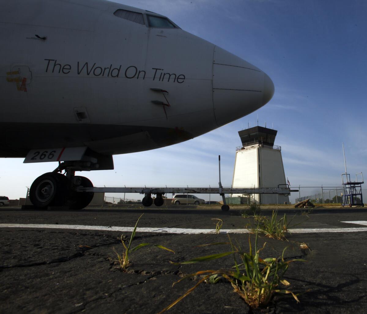 A FedEx plane at Riverside Municipal Airport, which might lose its control tower personnel.