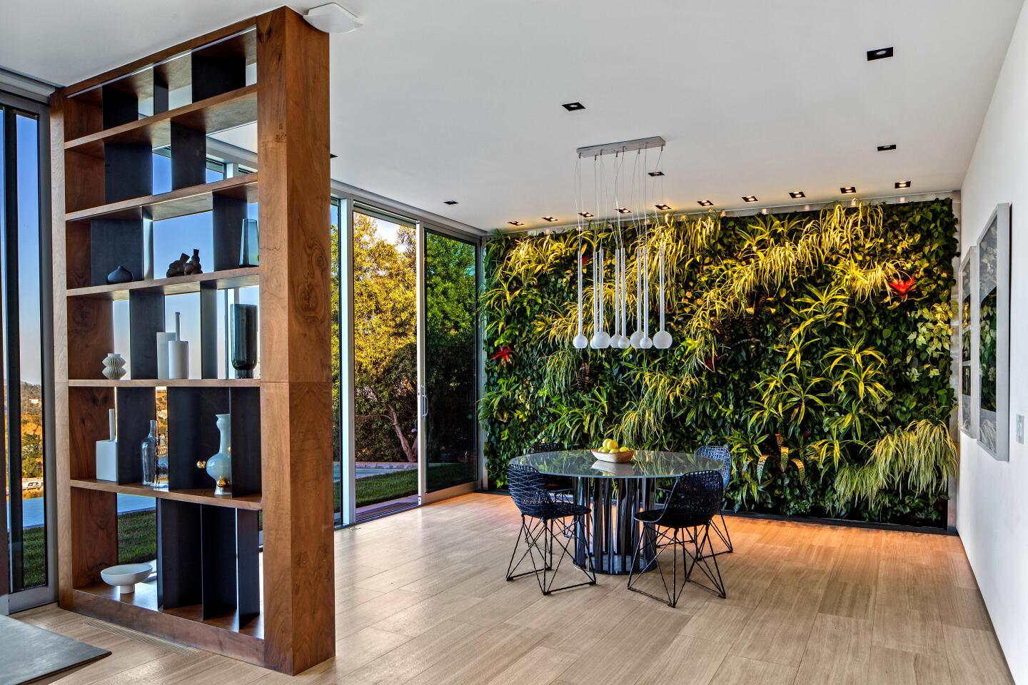 The dramatic Hollywood Hills home of musician Pharrell was designed by Hagy Belzberg and completed in 2007. Set atop a ridge, the modern showplace features an open-concept floor plan, walls of glass and a minimalist-vibe kitchen.