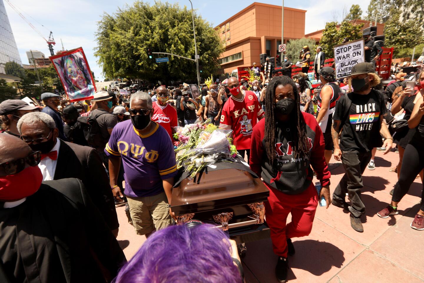 A coffin is carried at a memorial service honoring George Floyd in downtown Los Angeles.