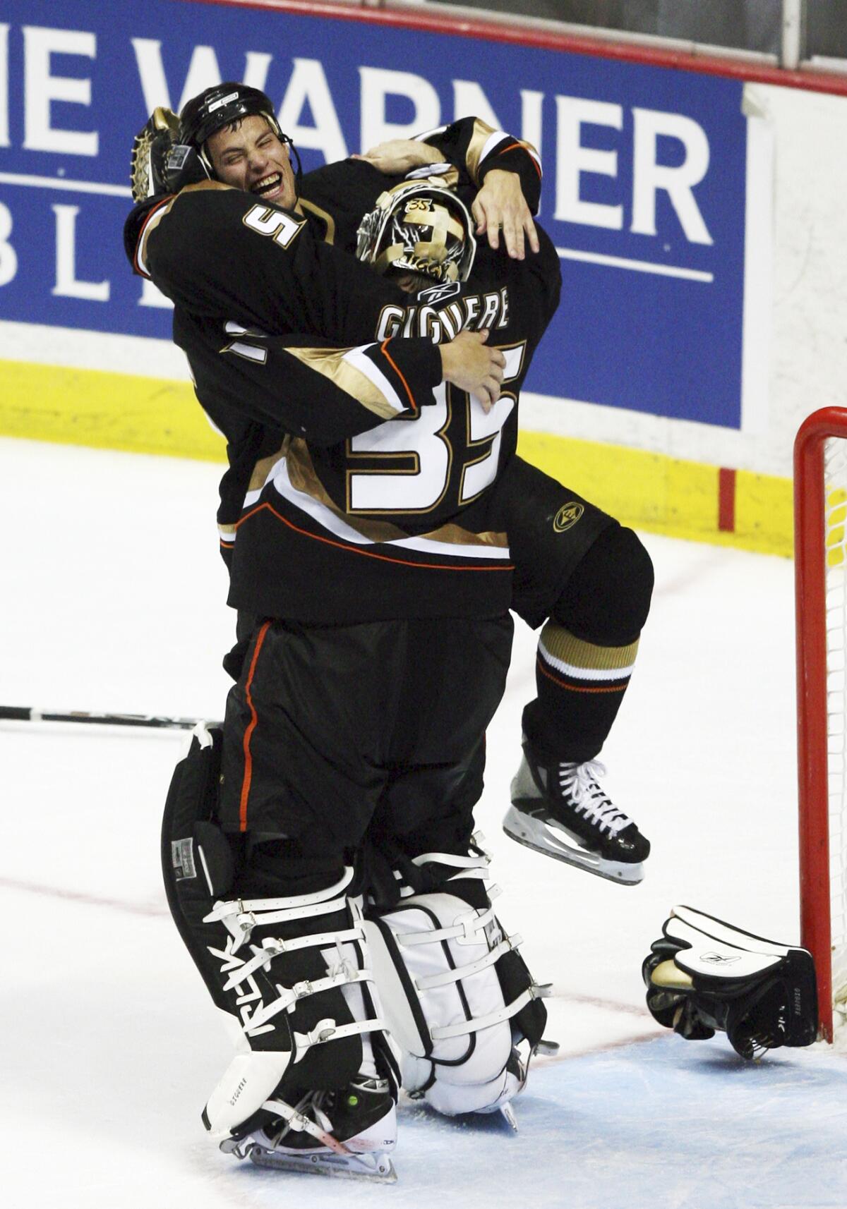 Ryan Getzlaf, left, jumps into the arms of Ducks goalie Jean Sebastian Giguere as they celebrate winning the 2007 Stanley Cup