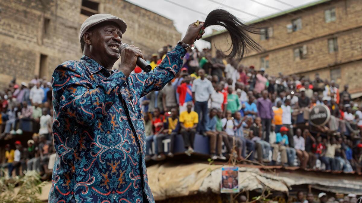 Opposition leader Raila Odinga addresses thousands of supporters gathered in the Mathare slum of Nairobi, Kenya, days after the August presidential election.