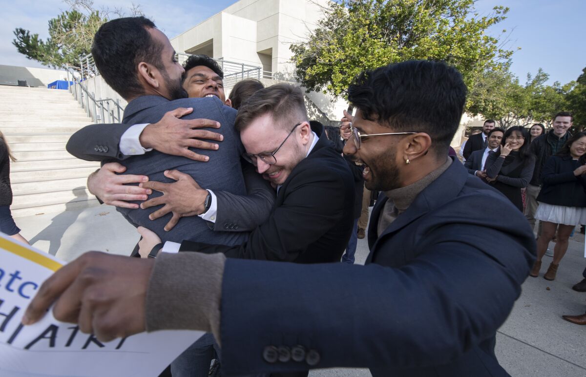 Students Anvesh Macherla, Will Jones (hidden), Austin Davis, and Himakar Nagam with Jaspal Bassi on UCI's Match Day Friday.