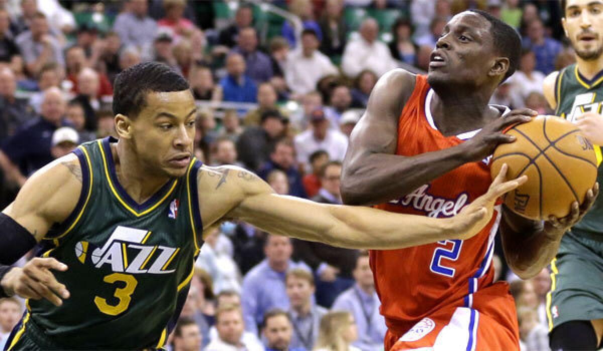 The Clippers' Darren Collison drives to the basket against Utah's Trey Burke on March 14.
