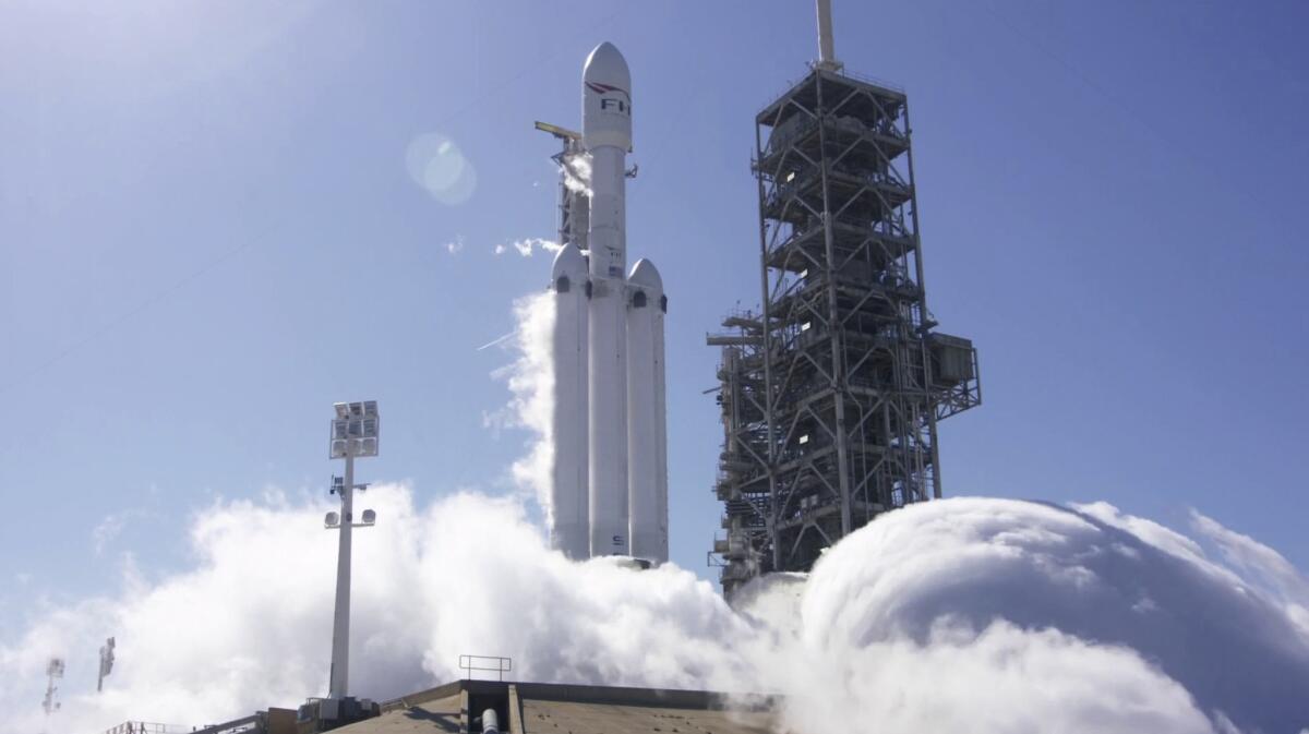 A SpaceX Falcon Heavy rocket is test fired at Cape Canaveral, Fla., on Jan. 24.