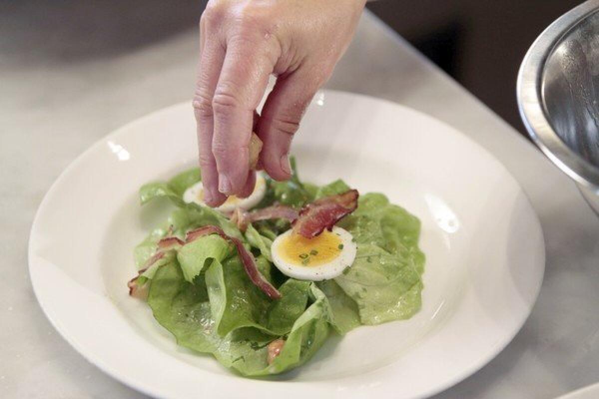 Master chef Nancy Silverton creates a salad named Butter Lettuce With Hazlenuts, Bacon, Gorgonzola Dolce, Egg and Sherry Vinaigrette at Mozza restaurant on Melrose Avenue in L.A.