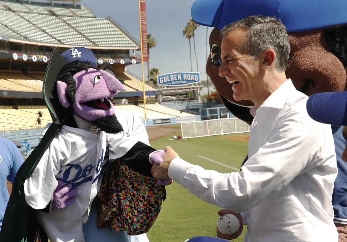 Mayor Eric Garcetti with Count von Count.