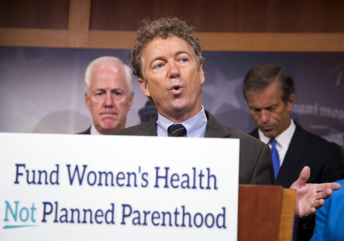 Sen. Rand Paul (R-Ky.), center, with Sens. John Cornyn (R-Texas), left, and John Thune (R-S.D.) speaks about Planned Parenthood in Washington last week.